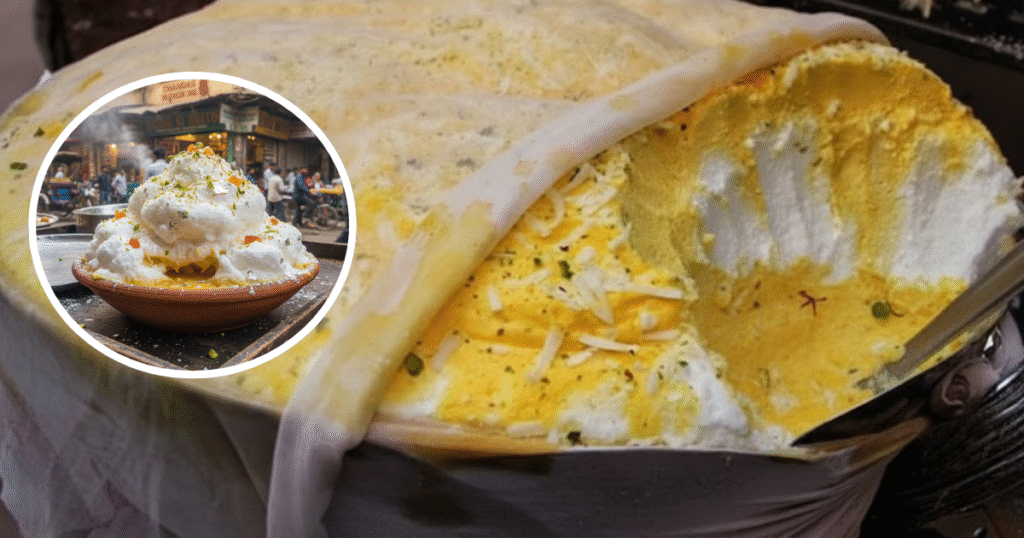 Close-up of frothy Daulat Ki Chaat topped with pistachios and saffron